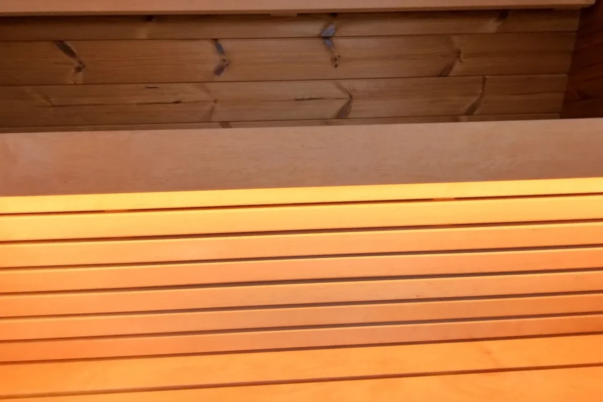 Rear bench beneath the illuminated Black Cube Classic backrest.