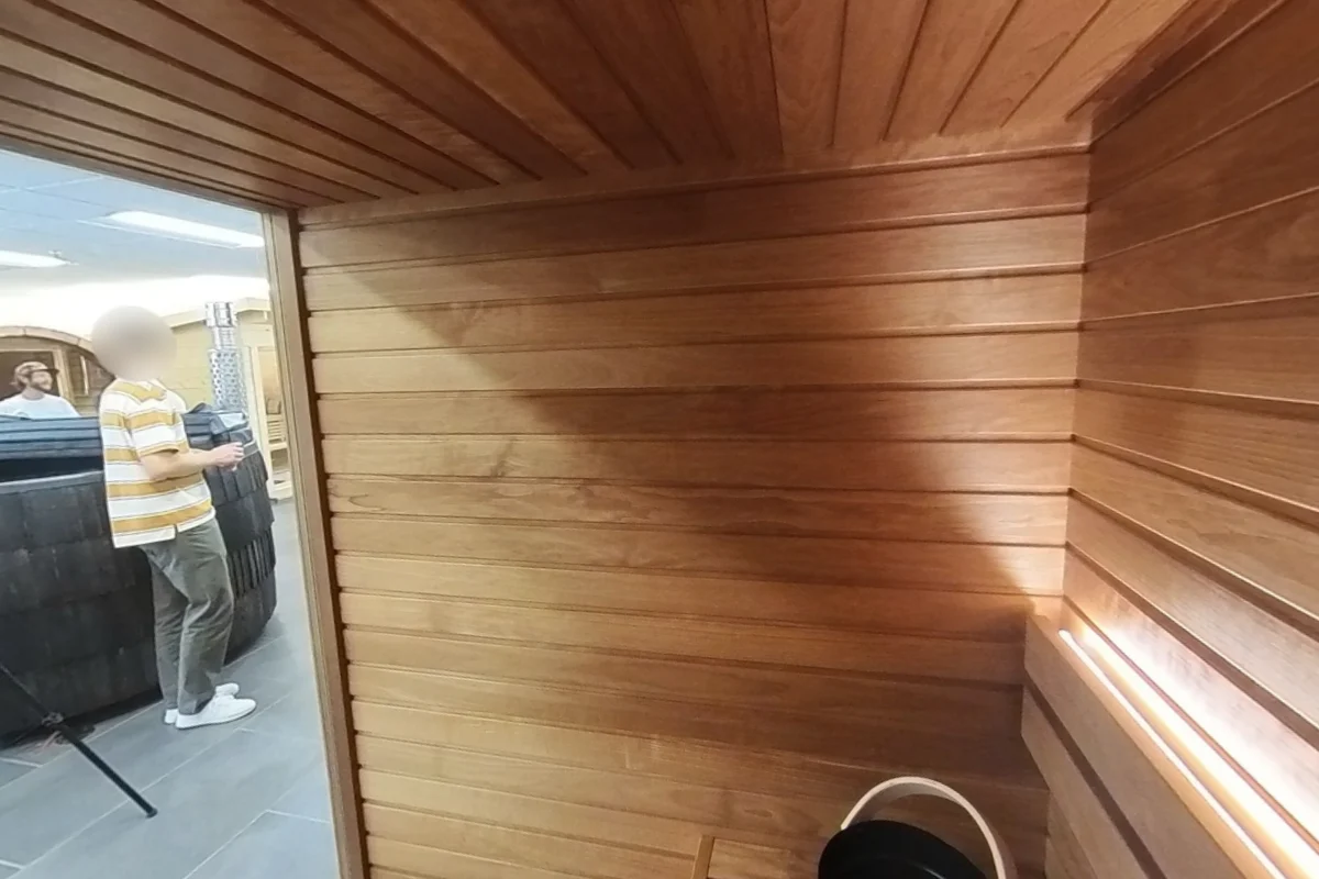 From the upper bench, the room beyond the glass remains visible.