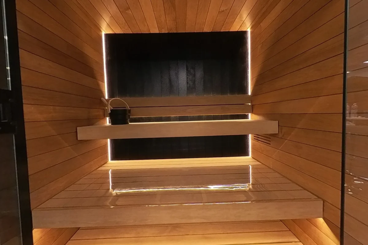 Light wood and the black feature wall share the Vulcana interior.