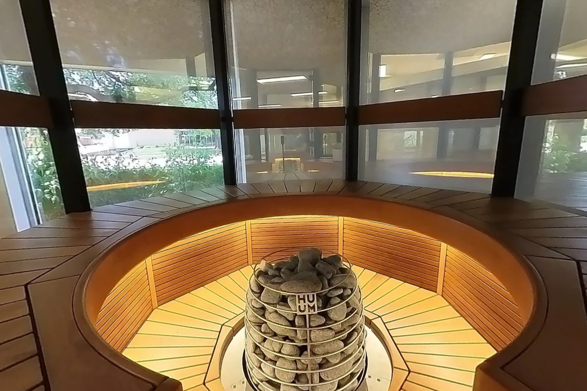 Curved perimeter seating surrounds the central heater in the Hele Single.