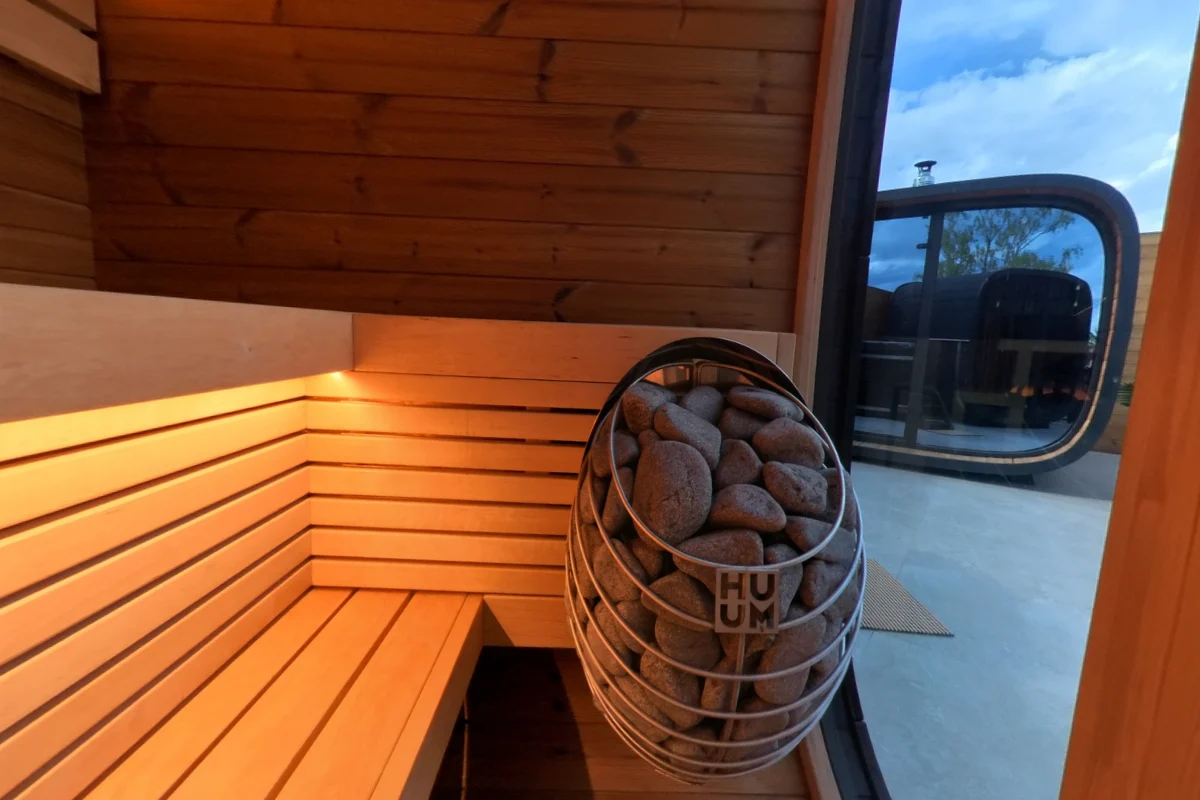 Black Cube Classic L-shaped seating beside the display heater.