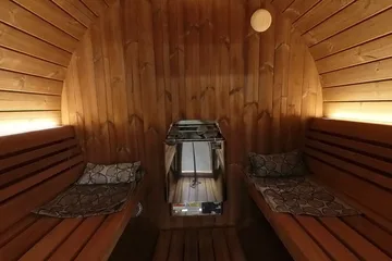 SaunaLife E7G Ergo Barrel, just inside: Look along the two benches toward the heater.