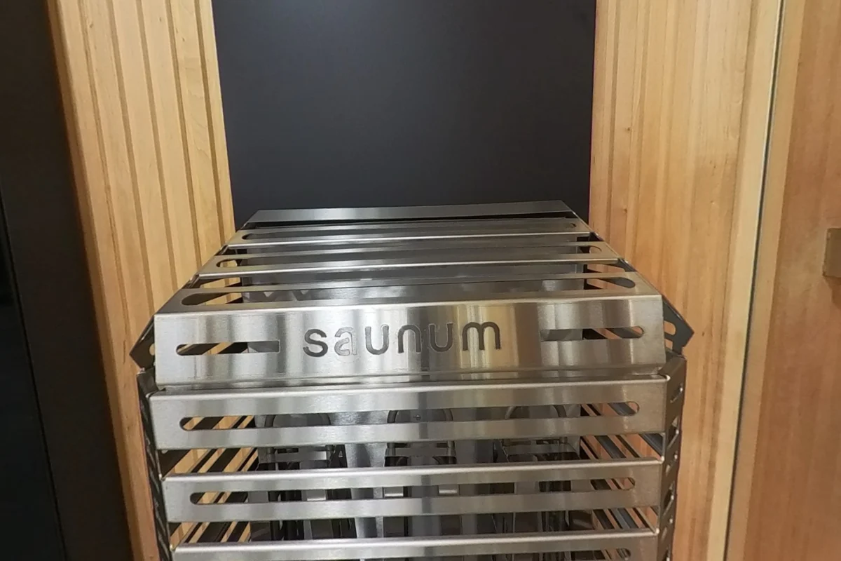 Open Saunum stone basket with the tall column behind it.