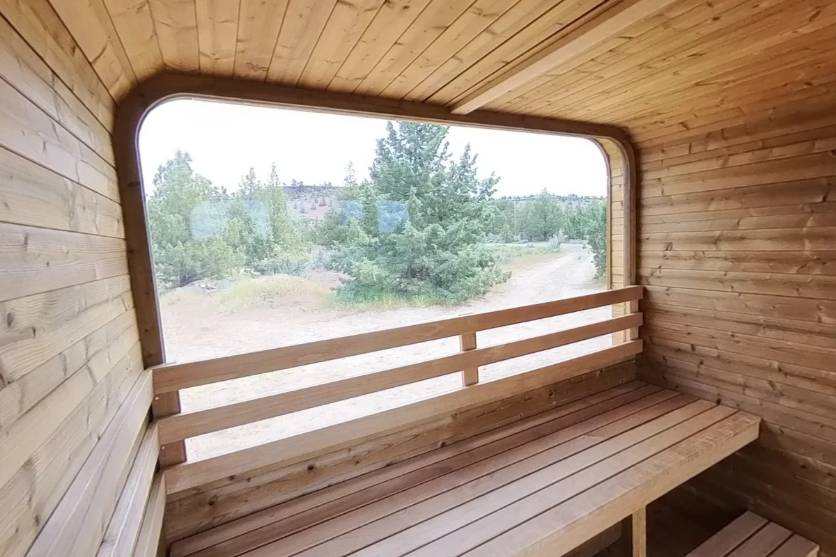 The rear bench and its backrest sit in front of the panoramic window.